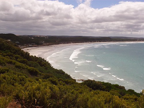 Surf rolling into a bay along the Great Ocean Road, Victoria