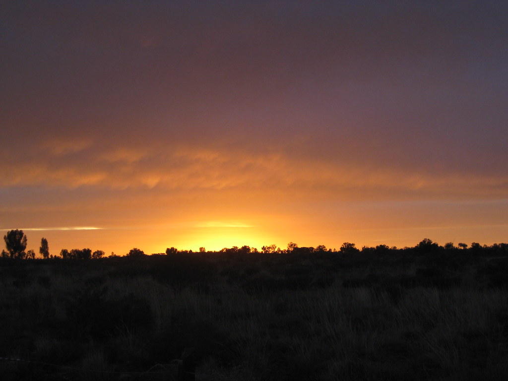 First light over the outback near Uluru, a new day beginning