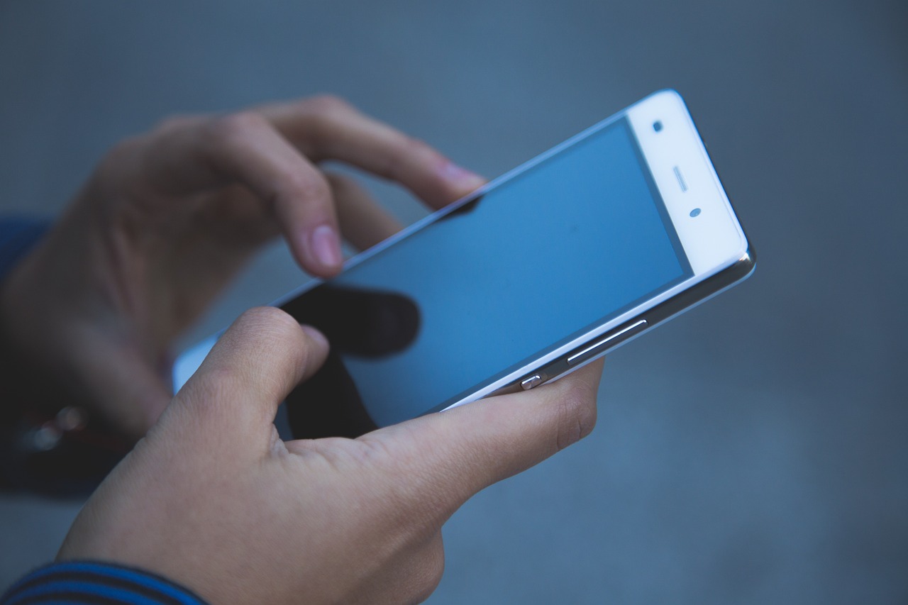 A hand reaching for the phone